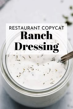 a jar filled with ranch dressing sitting on top of a table