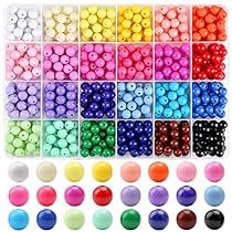 many different colors of beads are arranged in rows