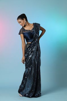 Go for a classy party look in this stunning navy blue sequin designer sequin saree. It comes with an embellished saree blouse. Shop designer sarees online in USA from Pure Elegance. Blue Embellished Semi-stitched Pre-draped Saree, Glamorous Blue Pre-draped Saree For Party, Glamorous Blue Pre-draped Saree, Evening Blue Pre-draped Saree With Mirror Work, Glamorous Blue Saree For Reception, Blue Sequined Blouse Piece For Evening, Blue Sequined Pre-draped Saree For Party, Blue Sequined Blouse For Evening, Blue Sequined Evening Blouse Piece