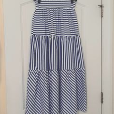 Blue And White Tiered Maxi Skirt With Alternating Horizontal, Vertical And Slanted Stripes. Pockets In Side Seams. Beautiful Fabric, Doesn't Wrinkle. Size Small. Purchased At A Small Boutique In Town. Elasticized Waist. Fabric Feels Really Nice. No Tags, But Never Worn. Blue Full Skirt Bottoms For Beach, Striped Midi Length Summer Bottoms, Striped Midi Length Bottoms For Summer, Blue Midi Skirt For Summer, Blue Full Skirt For Beach, Blue Lined Maxi Skirt For Day Out, Blue Long Skirt For Summer, Blue Summer Dress With Relaxed Fit, Blue Midi Length Bottoms For Vacation