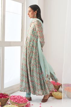 Aqua green floral print anrakali with hand embroidered tassel detail. Paired with solid pant and dupatta with tassels.
Component: 3
Pattern: Hand embroidered, Printed
Type Of Work: Mirror work, Digital print
Neckline: V neck
Sleeve Type: Full sleeves
Fabric: Cotton silk, Organza
Color: Green
Other Details: 
Churidar sleeves
Hand embroidered mirror tassels
Occasion: Mehendi, Reception - Aza Fashions Mirror Tassels, Churidar Sleeves, Green Mirror, Silk Peonies, Silk Organza, Mirror Work, Churidar, Full Sleeves, Aqua Green