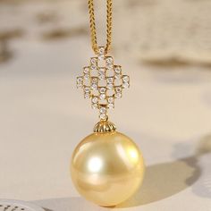 * Condition: Brand new * Center Stone: Natural Golden South Sea Pearl 13-14mm * Side Stone: Natural White Diamond, Round Cut, approx 0.15ct (VVS clarity with F color)  * Pearl Shape Grade: Perfectly Round * Metal Purity: 18K Solid Yellow Gold * Necklace Chain Length: 40-45cm (adjustable) * Superior pearls standard - 99% of the pearl surface is clean. An extremely detailed and up-close study of the pearl is needed to find imperfections. * The item will be gift wrapped and shipped. --------------- Luxury Yellow Gold Refined Pearl Necklace, Timeless Gold Pearl Necklace With Diamonds, Elegant Yellow Gold Pearl Necklace For Formal Occasions, Elegant Gold Pendant Diamond Necklace, Gold Necklace With Brilliant Cut, Exquisite Yellow Gold Pendant Pearl Necklace, Elegant Gold Necklace With Brilliant Cut, Elegant Gold Diamond Necklace For Everyday Luxury, Luxury High Luster Necklaces For Formal Occasions