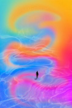 a man standing in the middle of an ocean with colorful swirls on his body