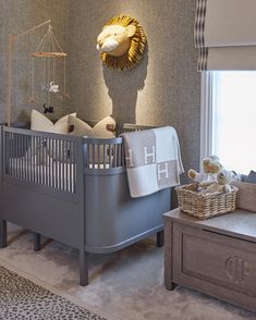 a baby's room is decorated in neutral colors