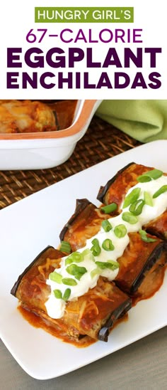 an eggplant enchiladas on a white plate with green onions and sour cream