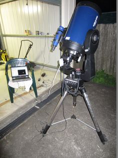 a telescope sitting on top of a tripod