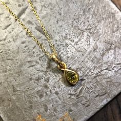 Green tourmaline gold-plated pendant. The necklace and the pendant are made in gold-plated silver. Material: vermeil, gold-plated silver Stone: green tourmaline Necklace:45cm Do not hesitate to check my Instagram as well: https://www.instagram.com/atelier_tiuh/ To go back to my shop: https://www.etsy.com/shop/AtelierTiuh?listing_id=780035814&ref=shop_overview_header Gold Briolette Birthstone Necklace Fine Jewelry, Gold Briolette Birthstone Necklace In Fine Jewelry Style, Gold Emerald Necklace With Delicate Chain, Fine Jewelry, Gold Briolette Birthstone Necklace, Gold May Birthstone Necklace In Fine Jewelry Style, Gold May Birthstone Necklace, Fine Jewelry Gold Emerald Necklace With Delicate Chain, Gold Emerald Necklace With Delicate Chain For Gift, Gold Teardrop Pendant Charm Necklace As Gift