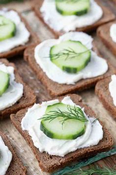 crackers with cucumbers and cream cheese on them