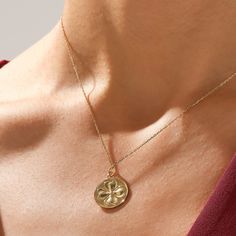 Embrace the spirit of luck with our Shamrock Coin Necklace. The pendant, featuring a delicately designed shamrock, is suspended from a radiant gold chain, creating a timeless accessory with a touch of Irish flair. This necklace adds a charming and whimsical element to any outfit. The Shamrock Coin Necklace is a beautiful embodiment of luck and style, making it a must-have addition to your jewelry collection. - Made in 14k solid gold - Pendant: 19.50x17.00 mm / 0.77x0.67 inches - Pendant Thicknes Dainty Flower Pendant Charm Necklace For Good Luck, Dainty Good Luck Flower Pendant Charm Necklace, Dainty Round Pendant Charm Necklace For Good Luck, Elegant Good Luck Pendant Charm Necklace, Good Luck Medallion Necklace With Charms, Yellow Gold Necklaces For Good Luck, Yellow Gold Good Luck Necklace, Gold Flower Pendant Necklace For Good Luck, Tarnish-resistant Yellow Gold Charm Necklace For Good Luck