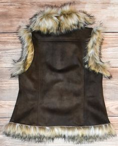 Stay cozy in style with the Luxe Vest! This fashionable leather vest keeps you warm with its plush faux fur lining and trim. So luxuriously comfortable you'll never want to take it off! True to size. Fur Vest Outfit, 2000s Room, Fur Vest Outfits, Descendants Oc, Trashy Outfits, Vest Outfit, Take It Off, Rose Boutique, Leather Vest