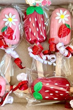 strawberry shortcakes wrapped in cellophane and decorated with flowers