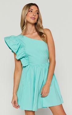 Get ready to turn heads in the Brodie Dress - a stunning one shoulder frill mini dress in vibrant green. This fit and flare dress is perfect for all your party day or night occasions. Made from cotton, it's both comfortable and stylish, ensuring you feel confident and empowered wherever you go. The one shoulder design adds a touch of elegance while the flirty frill detail adds a fun and playful element. Pair it with some killer heels and your favorite accessories for an unforgettable look that w Casual One-shoulder Ruffle Mini Dress, Fitted One-shoulder Mini Dress With Ruffle Hem, Spring Mini One-shoulder Dress With Ruffles, Green One-shoulder Mini Dress With Ruffles, Off-shoulder Pink Mini Dress With Ruffle Hem, Frill Mini Dress, Frill Dress, Killer Heels, Spring Season