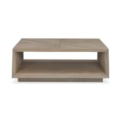 a wooden coffee table sitting on top of a white wall