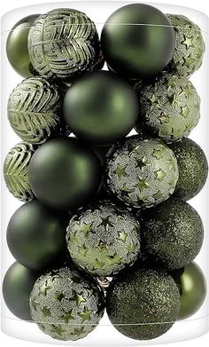 a bunch of green christmas balls in a box