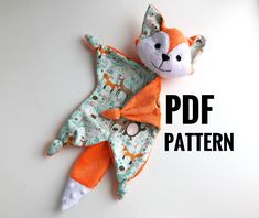 a stuffed animal laying on top of a table next to the text, free pattern