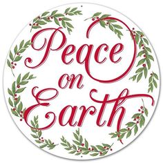 a peace on earth sticker with holly wreaths