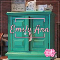 a green cabinet sitting on top of a table