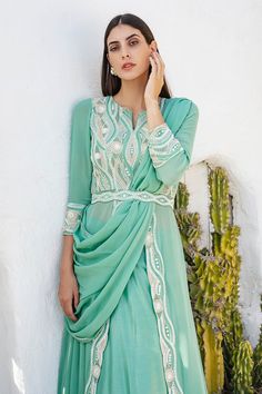 Mint green front open kurta with sequin and cutdana embellishment. Comes with lehenga and dupatta.
Components:3
Embroidery
Neckline:Notch
Sleeve Length:Three Quarter
Fabric:Georgette
Color:Green
Lehenga with lace trim hem
Cutout at the back with button closure
Closure: Side zip
Note: Belt worn by the model is not for sale - Aza Fashions Kurta Lehenga, Embroidery Neckline, Green Lehenga, Not For Sale, Set For Women, Aza Fashion, Front Open, Three Quarter, Lehenga