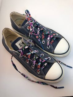 "Please note:  These laces are slightly narrower then our standard laces.  A pair of laces in a beautiful floral print fabric. Our Perfect Pair Laces are a great way to show the world how unique and fun you are. Pick a fun pair to outfit your favourite sneakers.  Each lace is handmade and measures appropriately 44\" in length and 1/4\" in width. Great for making that pair of Converse look extra unique.  This listing is for one pair of shoelaces as pictured, shoes and additional props are not included." Lace Skull, Floral Print Fabric, Great Lengths, Shoe Insoles, Converse Sneakers, Print Fabric, Perfect Pair, Shoe Laces, Printing On Fabric