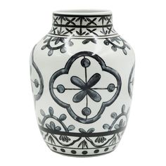 a black and white vase with an ornate design on the bottom, sitting against a white background