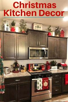 a kitchen decorated for christmas with holiday decorations on the counter top and oven in the middle