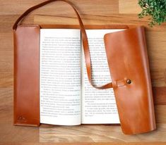 an open book sitting on top of a wooden table