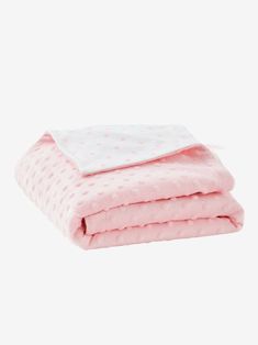 two blankets folded on top of each other in pink and white polka dot print fabric