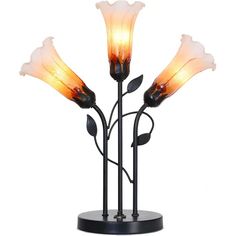 a lamp that is on top of a metal stand with three flowers in it and one light