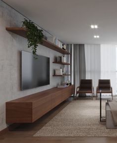 a living room filled with furniture and a flat screen tv on top of a wooden shelf