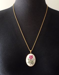 Royal Copenhagen necklace, pendant made of porcelain.  5 x 3.5 cm  (1.9 x 1.3") Chain is 60 cm (23.6") In very good condition. A-Grade (factory first) with no cracks and damages.  Comes completely with original box. White Flower Pendant Locket Necklace, Hand Painted White Pendant Jewelry, Hand Painted White Round Pendant Necklaces, White Hand Painted Round Pendant Necklaces, White Hand Painted Round Pendant Necklace, White Enamel Hand Painted Necklace, White Hand Painted Enamel Necklace, Hand Painted White Enamel Necklace, White Oval Necklace With Large Pendant