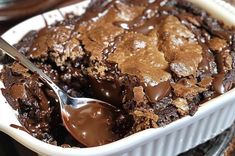 a white dish filled with brownies and ice cream