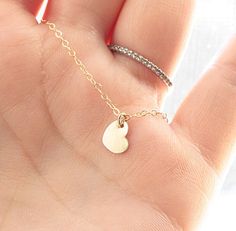 "Tiny Heart Necklace♥ The most shimmering & delicate flat cable chain is accented with a tiny little heart charm (8mm). A perfect everyday necklace. Necklace is complete with a round spring clasp. *Available in Sterling Silver or Gold Fill. ♥Your purchase will come thoughtfully packaged and ready for gift giving. If this purchase is a gift that we are shipping directly to the recipient, please let me know if you would like me to include a handwritten message, so they know who the gift is fro Sterling Silver Necklace Dainty, Rose Gold Heart Necklace, Heart Necklace Gold, Tiny Heart Necklace, Dainty Necklace Layered, Necklace Everyday, Minimal Necklace, Gold Filled Necklace, Rose Gold Heart