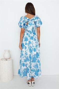 Length from shoulder to hem of size S: 130cm. Chest 36cm, Waist 30cm, size S. Maxi dress. White dress with blue pattern. Semi-lined. Model is a standard XS and is wearing XS. True to size. Non-stretch. Elastic sleeves. V-neck. Flowy skirt. Tie-up back. Elastic waist back. Zipper. Print placement may vary. Cold hand wash only. Polyester/Cotton. We adore this style and you will too! The Leaves Falling Maxi Dress features a V-neck design with a flowy skirt and tie-up back. Style with sandals to fee First Day Outfit, Fall Maxi, Leaves Falling, Maxi Dress White, Elastic Sleeves, Brunch Dress, Maxi Dresses Fall, Long Bodycon Dress, Shower Dresses