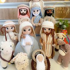 crocheted nativity figurines are displayed on a table