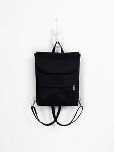 ► Black Aesthetic Backpack for minimal style lover Women. This waterproof Crossbody bag Backpack made with many pockets.  Midi-sized convertible backpack is great for everyday use, trips, and work. ► SIZE This bag is available in one size. But please contact me if you would like to change the dimensions! :) H 12,5 inch (32cm) * W bottom 9,5 inch (24cm) * D 4 inch (10cm) ► COLOR I can make this bag in many colors. If you like this design, any color variation is possible. You can see the available Everyday Backpack Shoulder Bag With Anti-theft Pocket, Everyday Shoulder Bag Backpack With Anti-theft Pocket, Minimalist Backpack Shoulder Bag For Daily Use, Minimalist Backpack For Daily Use, Minimalist Backpack Shoulder Bag With Adjustable Strap, Anti-theft Backpack For Everyday Use, Everyday Rectangular Backpack With Anti-theft Pocket, Minimalist Shoulder Bag Backpack For Travel, Modern School Backpack With Anti-theft Pocket