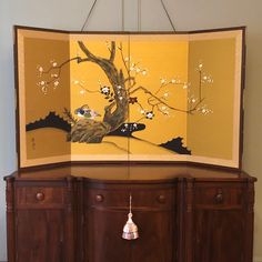 Offering a beautiful hand-painted, four-panel Asian screen from the mid-20th century featuring wild birds at rest in nature in rich and vivid detail. The screen's four silk panels are finished in a vivid gold and set within in a mahogany-colored lacquered wood frame. It features a textured silk brocade border and decorative brass hardware and folds up to the nice compact size of a single panel. This lovely vintage screen can be hung on a wall (and has appropriate brass hardware attached for this Asian Screen, Silk Screen Art, Screen Art, Screen Painting, Mahogany Color, Bird Motif, Lacquered Wood, Wild Bird, Japanese Silk