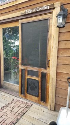 the front door of a house with an old fashioned speaker on it's porch