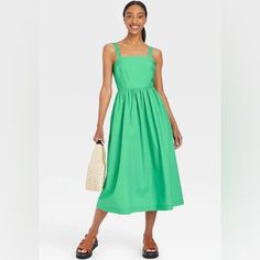 Women's Sleeveless Sundress In Green Green Cotton Midi Length Sleeveless Dress, Green Cotton Midi-length Sleeveless Dress, Green Cotton Sleeveless Midi Dress, Sleeveless Sundress For Spring Brunch, Green Cotton Sleeveless Dress For Spring, Green Casual Sleeveless Dress For Spring, Spring Sleeveless Spaghetti Strap Dress For Day Out, Spring Sleeveless Dress With Spaghetti Straps For Day Out, Spring Sleeveless Midi Sundress