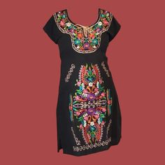 Mexican embroidered dresses | Kimono Traditional Mexican dresses | Authentic Mexican Dress | Floral Embroidered Dress  *Embroidery color may differ 100% Cotton Made in Chiapas, Mexico Perfect loose fit for a casual day Breathable woven fabric Side ties for an adjustable fit, each tie is 19 inches long. We recommend washing on delicate or by hand with cold water, Hang to Dry to better preserve the original color Mexican Dress for Women Floral style Para mujer vestido mexicano Vestido bordado tipicos Boho style Sizes:   Small: Bust 85 cm (33.4") Medium: Bust 90 cm (35.4") Large: Bust 95 cm (37.4") XL= US XL=100CM（Bust~39.4") US 2XL=105CM （Bust ~41.4" ) Embroidery may differ * This Women's summer dress is suitable for many occasion, casual daily wearing, shopping, party, working, beach, weddi Multicolor Geometric Embroidery Dress For Festivals, Festival Dresses With Geometric Embroidery, Multicolor Short Sleeve Dress With Geometric Embroidery, Traditional Dress With Multicolor Floral Embroidery, Folk Style Dresses With Resham Embroidery, Folk Dresses With Multicolor Resham Embroidery, Festival Dress With Multicolor Geometric Embroidery, Multicolor Short Sleeve Dress With Embroidered Border, Multicolor Dresses With Embroidered Border And Short Sleeves