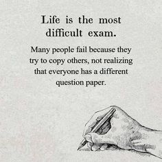 a hand holding a pen writing on paper with the words life is the most difficult exam many people fail because they try to copy others, not realizing that everyone has a different question paper