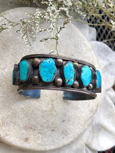 Circa Raw Sleeping Beauty Turquoise Sterling Silver Native American Vintage Antique Cuff Bracelet has lots of beautiful patina Face measures 1 inch wide inner diameter of 6 inches plus a 1/2 inch gap, slightly adjustable Adjustable Turquoise Bracelet With Patina, Adjustable Turquoise Bracelets With Patina, Adjustable Blue Cuff Bracelet With Patina, Artisan Blue Cuff Bracelet, Adjustable Blue Patina Cuff Bracelet, Adjustable Turquoise Artisan Cuff Bracelet, Adjustable Turquoise Cuff Bracelet, Adjustable Turquoise Cuff Bangle, Adjustable Turquoise Bangle For Collectors