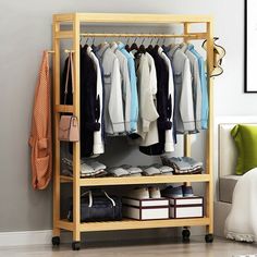 a wooden rack with clothes and shoes on it in a bedroom next to a bed