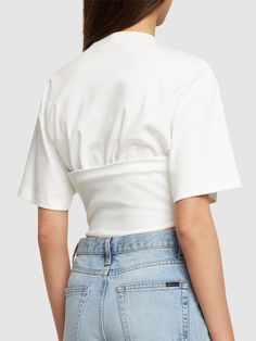 Corset structure at hem with front with lace-up closure. Model is wearing a sizeS Fitted White Top With Cropped Hem, Fitted White Cropped Top, White Fitted Top With Cropped Hem, White Fitted Crop Top With Cropped Hem, Fitted Cropped Top For Spring, Modern White Crop Top For Spring, Modern White Spring Crop Top, White Cotton Cropped Hem Top, White Cropped Cotton Top