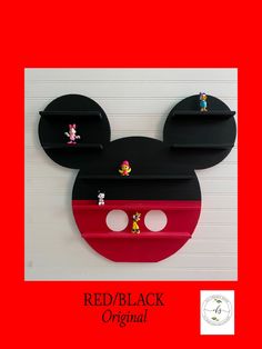 the mickey mouse head has been painted red and black