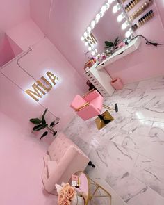 a room with pink walls and marble floors