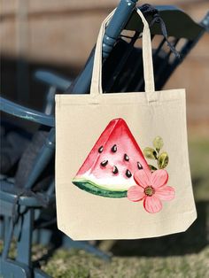 a watermelon tote bag hanging from a chair