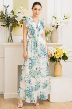 FINAL SALE. NO RETURNS. NO EXCHANGES. Cecile maxi floral dress has it all - a comfy elastic waistband, a ruffle v-neck, and a button-down design with charming ruffle skirt details. Get ready to make heads turn and feel absolutely fabulous in this must-have dress. LENGTH: 56" from top of shoulder STYLE#: DR-21063 in MAGIC BLOSSOM IVORY -S24 *Dry clean or wash on cold, and hang flat to dry.*Model is wearing a size XS V-neck Ruffled Maxi Dress For Daywear, Dancesport Dresses, Maxi Floral Dress, Quinceñera Dresses, Neoprene Dress, Skirt Details, Yumi Kim, Maxi Dress Wedding, Daytime Dresses