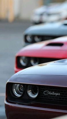 a row of red and black cars parked next to each other