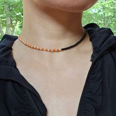 Choker necklace made with beautifully colored Miyuki beads, unique asymmetrical design. 14K gold plated 316 stainless steel lobster claw clasp. This Necklace also come in Black and light blue options. Safe to wear in water.  See more seed bead necklaces at my store:  https://www.etsy.com/shop/FayFayJewelry?ref=dashboard-header&section_id=50377409 Visit my store for more unique handmade jewelry pieces: https://fayfayjewelry.etsy.com All Jewelry pieces in this store are designed and handmade by my Orange Beaded Necklaces With Spacer Beads As Gift, Adjustable Orange Necklace With Spacer Beads, Orange Necklace With Black Round Beads, Orange Necklace With Black Beads For Gift, Gift Necklace With Orange And Black Beads, Adjustable Orange Necklaces With Black Beads, Adjustable Orange Necklace With Black Beads, Orange Choker, Choker Necklace Black