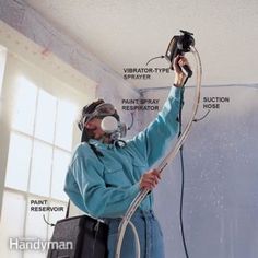 a man is spraying water on the ceiling with a sprayer and air conditioner